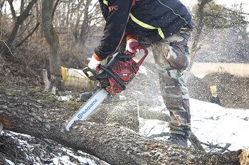 a man working with chainsaw